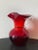 A beautiful American hand blown crackled art glass pitcher in bright red, circa mid 20th century, USA. Piece can be used...