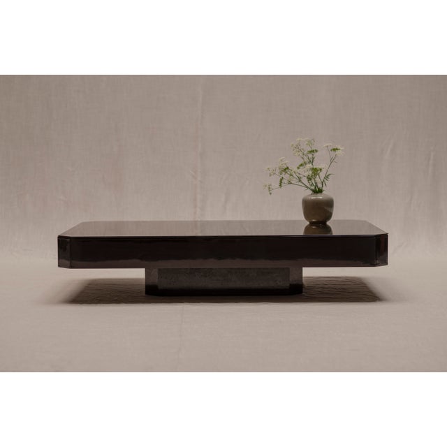 Striking and large Space Age coffee table from the 1970s, executed in a rich dark brown high-gloss lacquer finish and...
