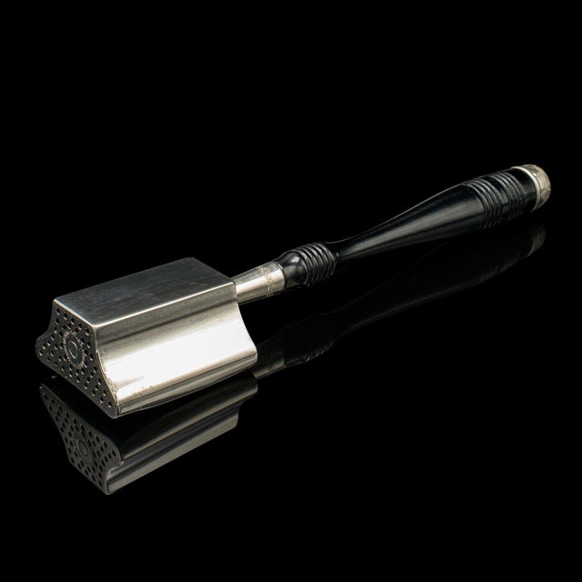 This is an antique McDonald's rotary hat iron. An American, nickel and ebonised millinery tool in original box, dating to...