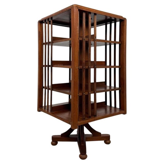 A highly desirable early 20th-century Edwardian oak revolving bookcase, combining ingenious functionality, generous...