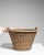 This mid 20th century basket from France is finished in tan, worked in wicker. Its form follows honest, well-proportioned...