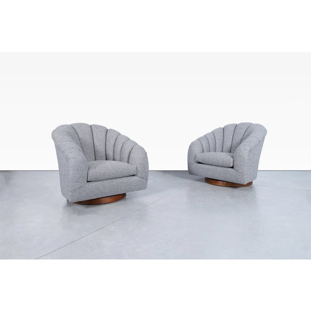 Mid-century modern walnut swivel chairs manufactured by Directional during the 1970s. Beautifully restored, these...