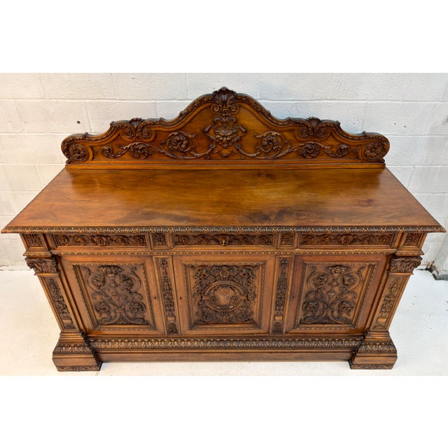 Magnificent Antique French Renaissance Revival carved oak buffet, distinguished by its exceptional craftsmanship,...