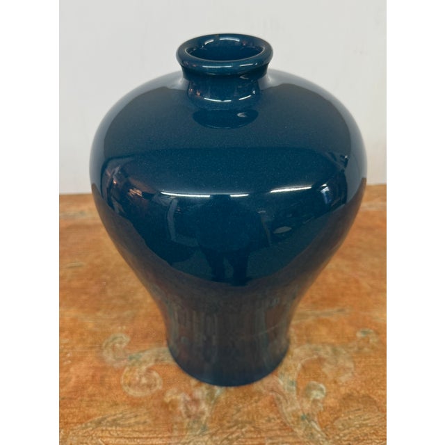 Design Plus Gallery presents a Plum Blossom Ceramic Vase from Martino Interiors. A glossy blue glaze covers the rounded...