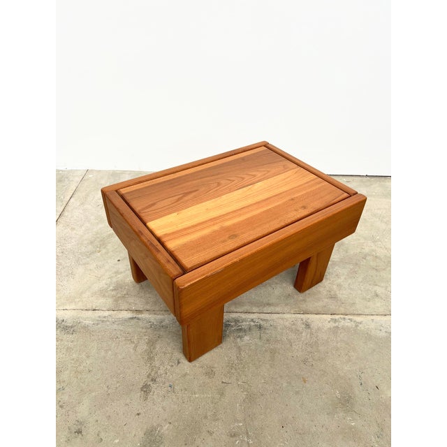 A coffee table or side table in solid elm from Maison Regain. Its low height and sturdy construction make it ideal for...
