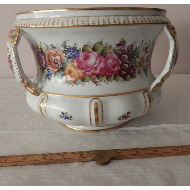 This marvelous late 19th Century antique jardiniere is created in gorgeous hard paste porcelain and is hand-painted with...