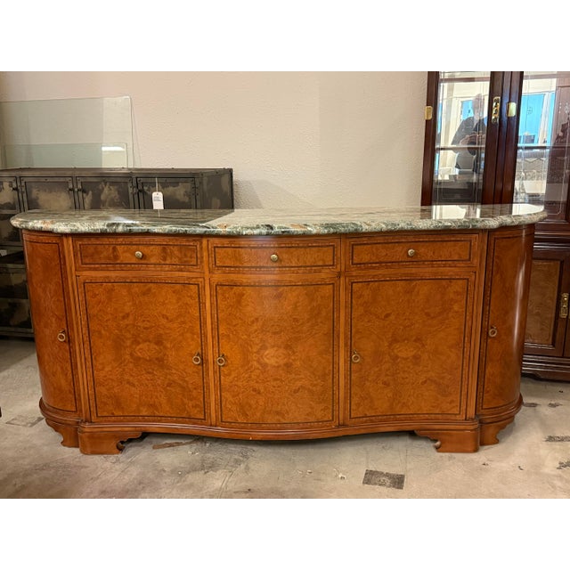 Design Plus Gallery presents a Custom Design Louis XVI–Style Credenza. The credenza features a graceful serpentine front...