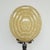 An Art Deco table lamp. Reeded bakelite stem with an impressive sized mottled glass shade, set over a circular chromed...