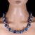 This striking 25-inch kyanite necklace showcases the captivating beauty of chatoyant kyanite gemstones in an elegant...