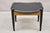 Norco Mid Century Modern Sculpted Footstool Ottoman with Tapered Legs and Black Vinyl Seat Age: Mid 20th Century...