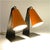 Pair of table lamps model 1246 hook from J.T. Kalmar Vienna. Consisting of an orange painted aluminum shade mounted on a...