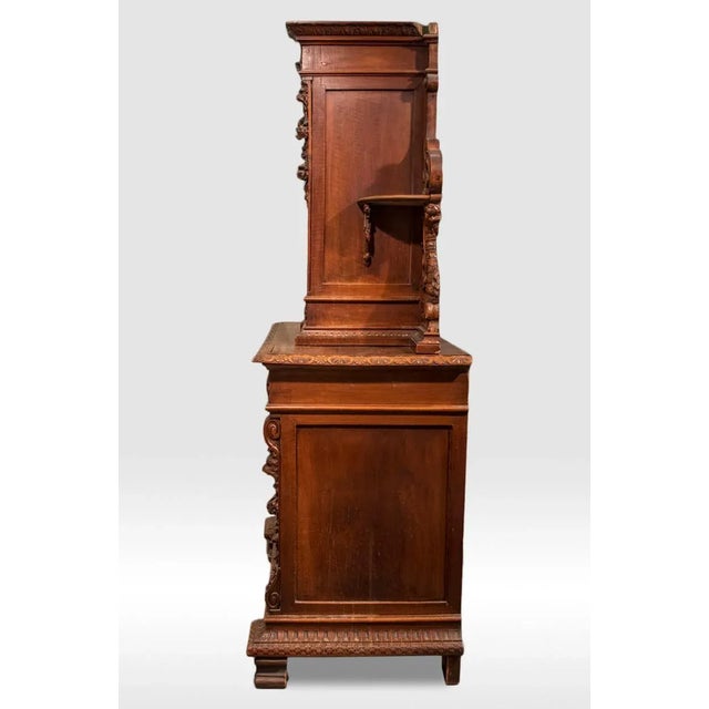 Small walnut Neo-Renaissance style two-tiered sideboard opening with two door leaves in the lower part and one door leaf...