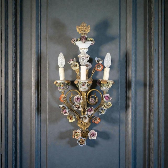 Rare set of four 19th century Wall lights ornamented with colorful porcelain flowers and finely chiseled gilt bronze...