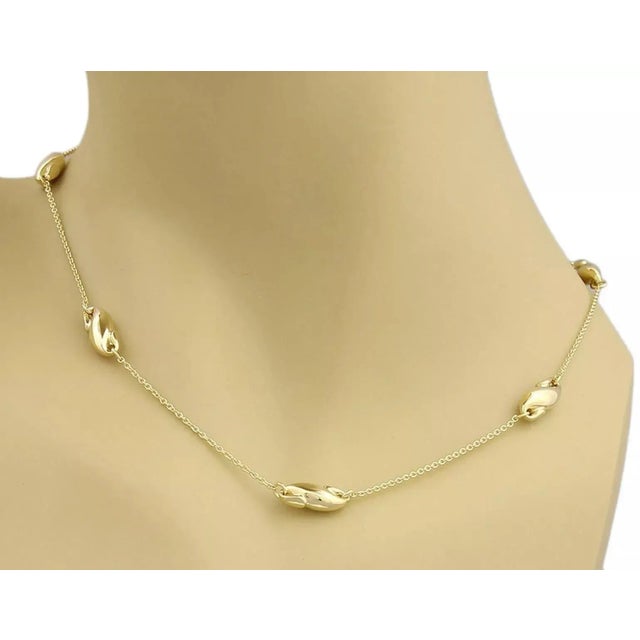 Material: 18k yellow gold Hallmark: Tiffany & Co. 750 Elsa Peretti Measurement: 16" long and 6mm wide x 5mm high Weight:...