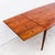 Vintage boat-shaped draw leaf dining table in Brazilian rosewood, made in Denmark c. 1960s. The bowed edge, tapered legs,...