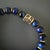 The Tiger's Eye Gladiator Beaded Bracelet, a bold and captivating handmade accessory that combines the striking beauty of...