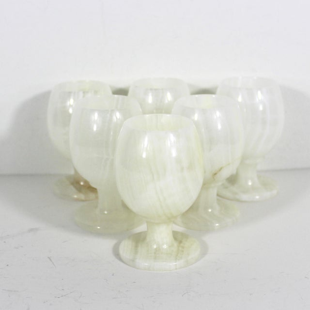 Gorgeous set of six white onyx cups with beautiful veining. This is naturally coloured Italian onyx. Could be used for tea...