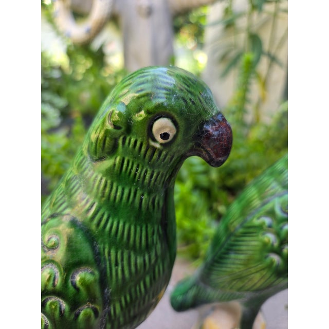 A pair of Chinese roof finials in the form of parrots. used to adorn green tiled roves in China. Indoor or outdoor