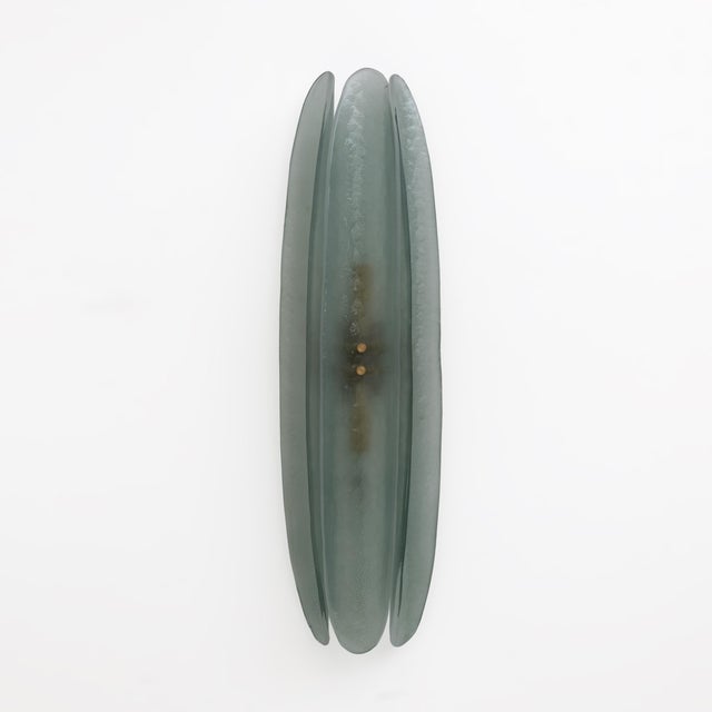 Wall sconces composed of three organic elements frosted curved Murano glass in the shape of a leaf in the color aquamarine...