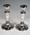 Pair of elegant silver candlesticks on a sweeping, oval base with stepped frame, at the foot of the shaft circumferential,...