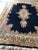 Deep cobalt and rose colored Kerman Persian rug in excellent semi-antique condition. Wool, tightly woven dense knots...