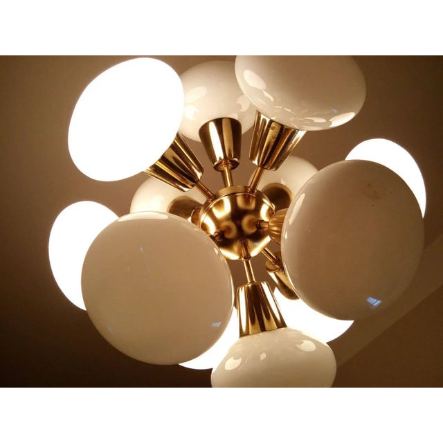 - Czechoslovakia, 1970s - Nice and original condition with patina - 12 lights- Intact glasses. This piece is attributed to...