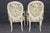 Graceful, romantic, and quintessentially French, this pair of Louis XV style painted armchairs beautifully captures the...