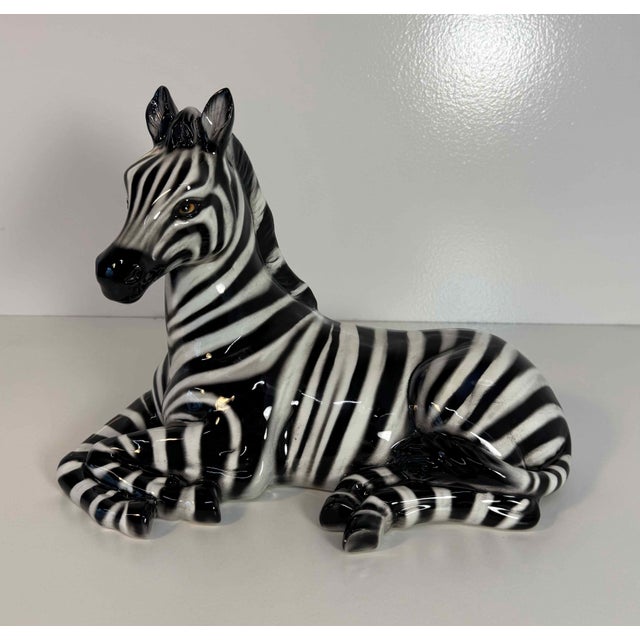 Hand-decorated in glazed ceramic, it features beautifully rendered black and white stripes with a glossy finish that...