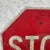 A striking vintage aluminum STOP sign, measuring a full 24” x 24”, with beautifully aged patina and authentic wear from...