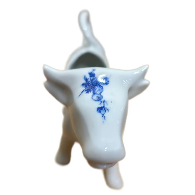 Bring a touch of French countryside charm to your home with this delightful porcelain cow creamer. Marked “France F.D....