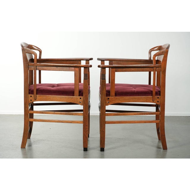 Offered for sale is this set of two Art Nouveau/Jugendstil design Schuitema dining chairs with luxurious red fabric...