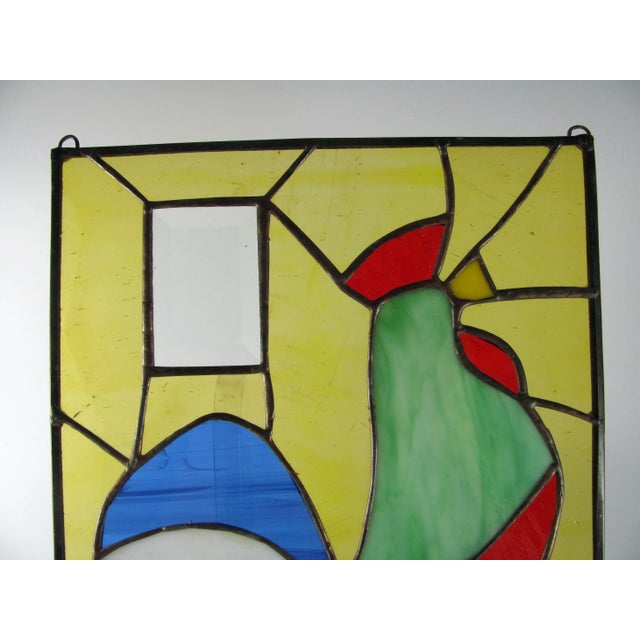 Well made, thick and sturdy with soldered eyes on back for hanging Clear rectangular glass piece is beveled Weighs 1-3/4 lbs