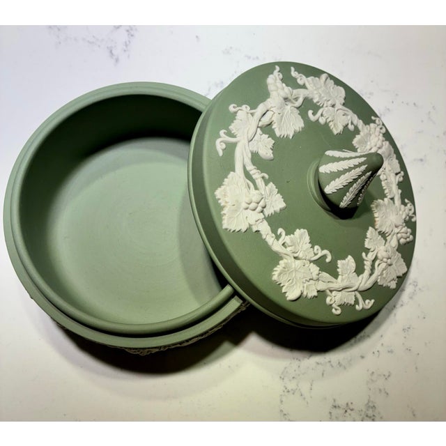 Vintage Wedgwood jasperware porcelain box with a frieze of bad-relief grapevines and foliage. Marked “Wedgwood Made in...