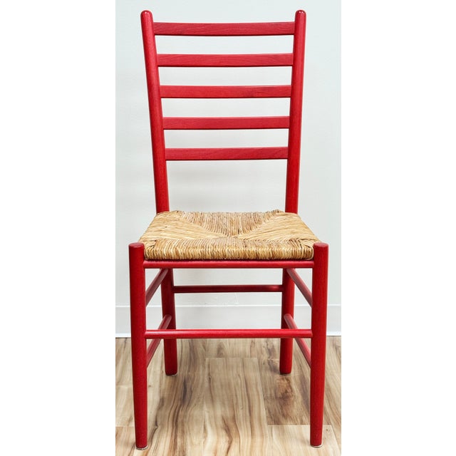 Vintage ladderback chair with vibrant red painted frame and woven rush seat. Modern meets traditional with this fabulous...