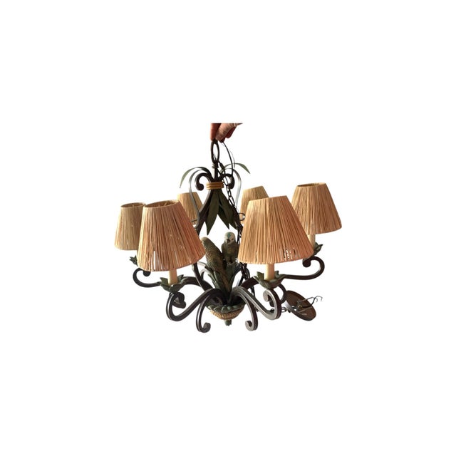 The MCM Wrought Iron Parrot Chandelier is a unique and stylish lighting fixture that adds a touch of elegance to any room....