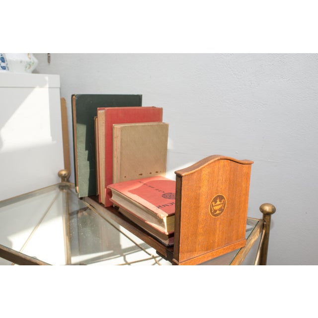 A beautiful and functional antique Victorian mahogany book slide, English, circa mid-to-late 19th century. These elegant...