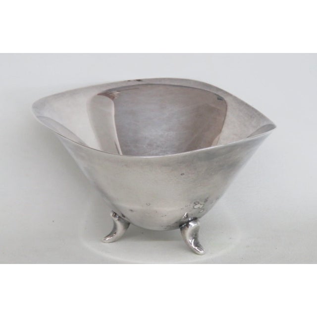 This gorgeous Three Footed Bowl is silver plated. This stunning and highly collectible dish features an eye-catching...