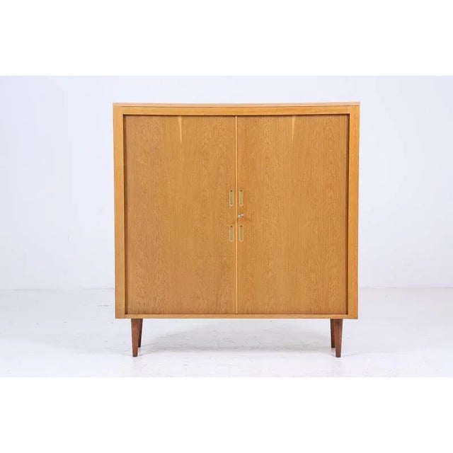 Beautiful vintage cabinet with louvre doors from the 60s FEATURES * Manufacturer: Werner Stehroll * Timeless vintage...