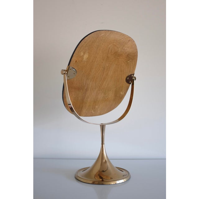 Impressive 1960s Brass table mirror by Bergbom from the B-024 series. The trumpet shaped base have 2 arms that holds the...