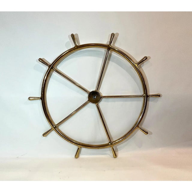 Brass ships wheel that has been meticulously polished and lacquered. Five spokes with ten handles. Stunning piece, five...