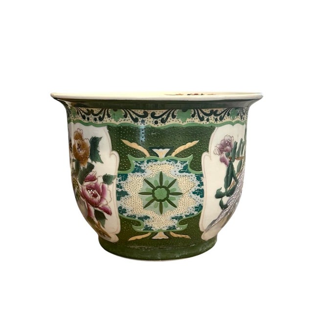 A gorgeous, vintage Famille Rose cachepot. Features a pair of peacocks surrounded by florals on a white ground and...
