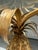 Pair of Mid-Century Italian Hollywood Regency Brass Pineapple Side Tables. The pair of side tables feature a highly...