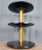 Ralph Lauren Wyman side table with three tiers of black marble and knurled brass column. Direct from a local estate, this...