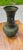 Stunning vintage bronze hu-form vase featuring dramatic elephant-head handles and intricate archaic Chinese taotie and...