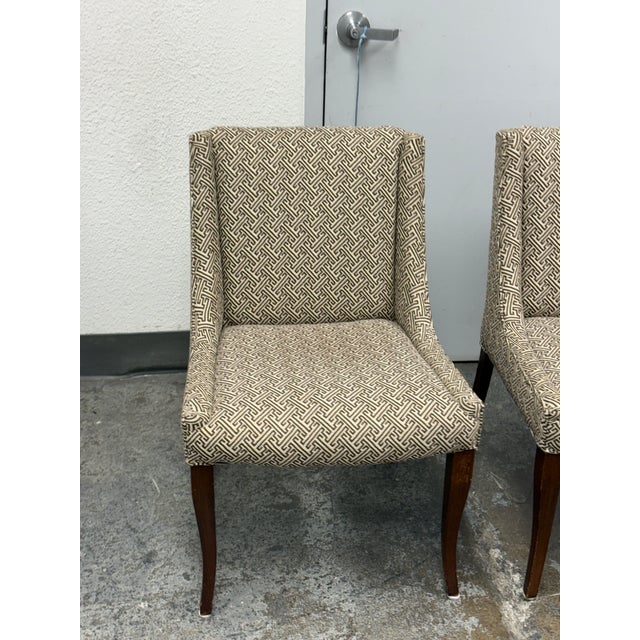 Design Plus Gallery presents a Pair of Custom Upholstered Side Dining Chairs. The fabric is of a Sayagata pattern; a...