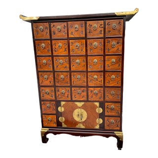 Asian Wooden Apothecary Cabinet With Brass Accents For Sale