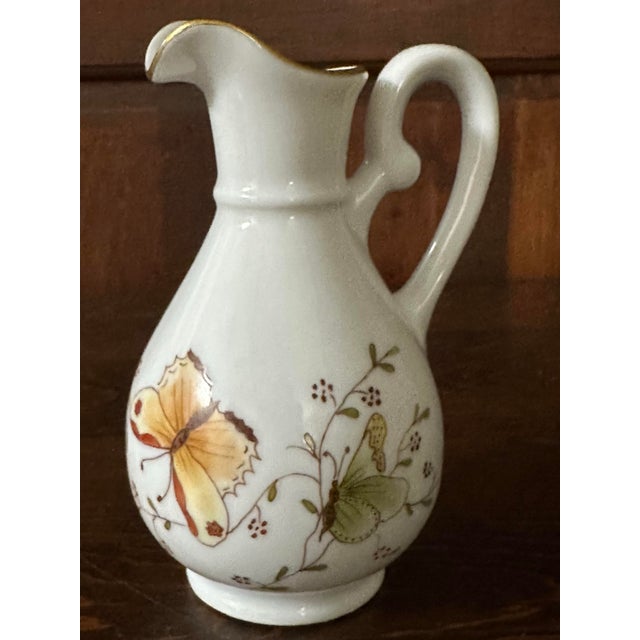 Vintage white porcelain creamer dish (min pitcher/mini vase) with hand painted butterflies, flowers and gold along the...
