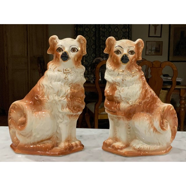 Up for your consideration in this characterful antique pair of Bo’Ness glazed earthenware russet & white Wally Spaniel dog...