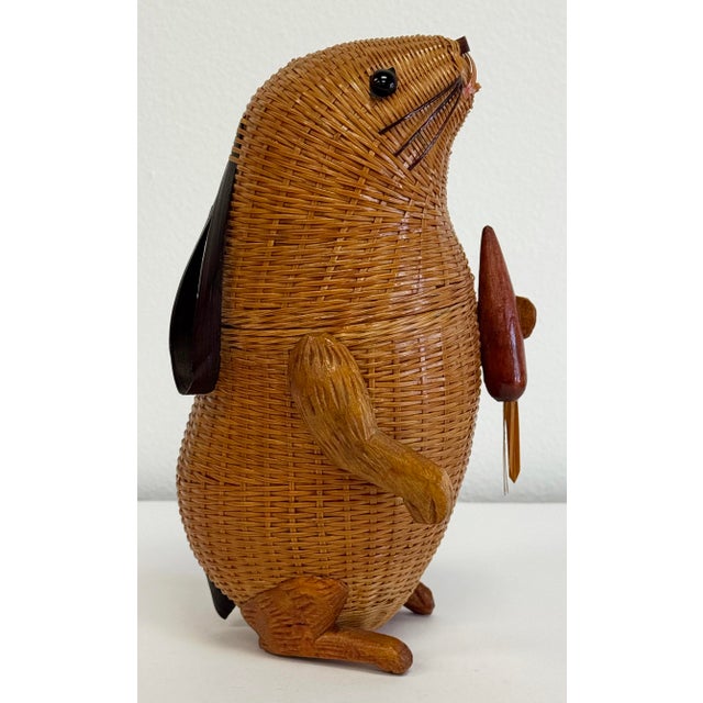 Vintage Shanghai Handicraft woven wicker rabbit. Features glass eyes, split reed rattan for ears, wood legs and the top...