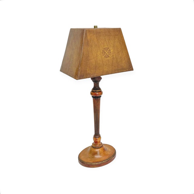 A beautiful antique English table lamp made of turned and carved walnut, with a fluted shaft resting on an oval base...